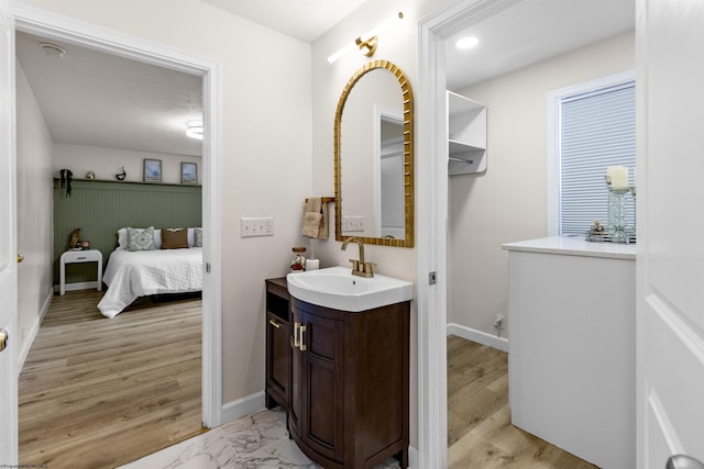 bathroom with vanity and hardwood / wood-style floors