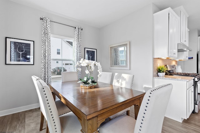 dining area with light wood-type flooring