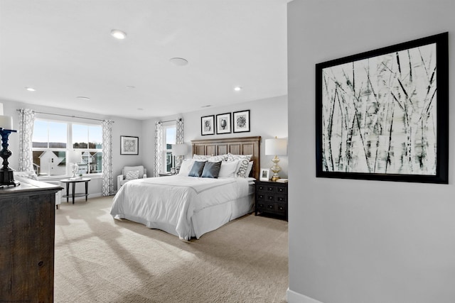 bedroom featuring light carpet