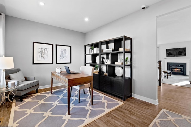 office space with hardwood / wood-style flooring