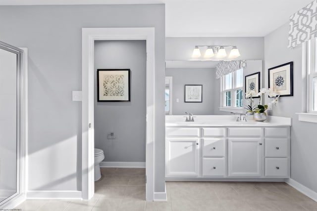 bathroom featuring vanity, an enclosed shower, tile patterned flooring, and toilet