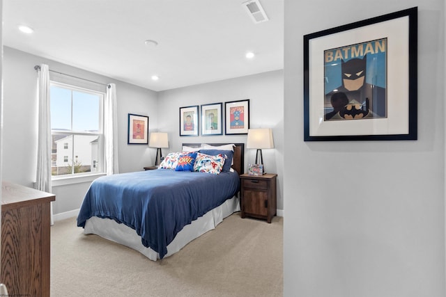 bedroom with light colored carpet