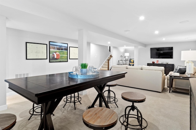 dining area with light colored carpet