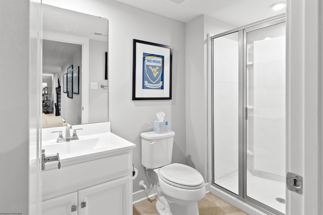 bathroom with an enclosed shower, vanity, tile patterned floors, and toilet