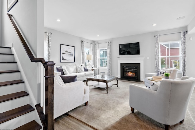 living room with plenty of natural light and light wood-type flooring