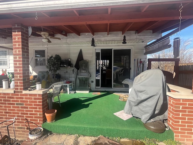 view of patio / terrace featuring ceiling fan and an outdoor bar