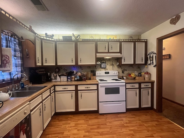 kitchen with a textured ceiling, sink, light hardwood / wood-style flooring, and white range with electric stovetop