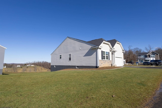 view of home's exterior featuring a garage and a lawn