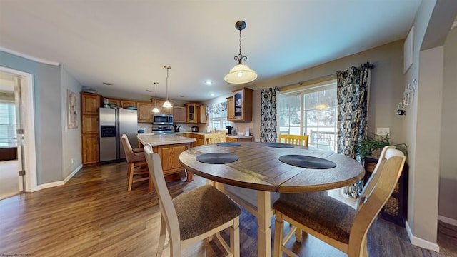 dining space with hardwood / wood-style flooring and plenty of natural light