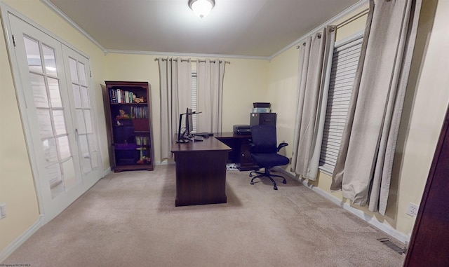 carpeted home office with ornamental molding and french doors