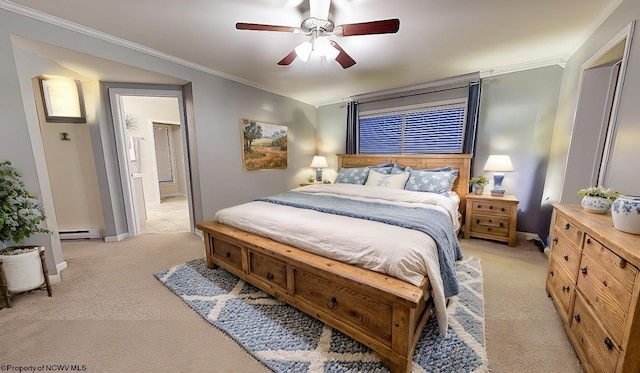 carpeted bedroom featuring ceiling fan, ornamental molding, ensuite bath, and a baseboard heating unit