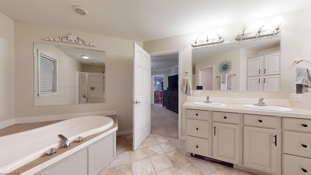 bathroom with vanity, shower with separate bathtub, and tile patterned flooring