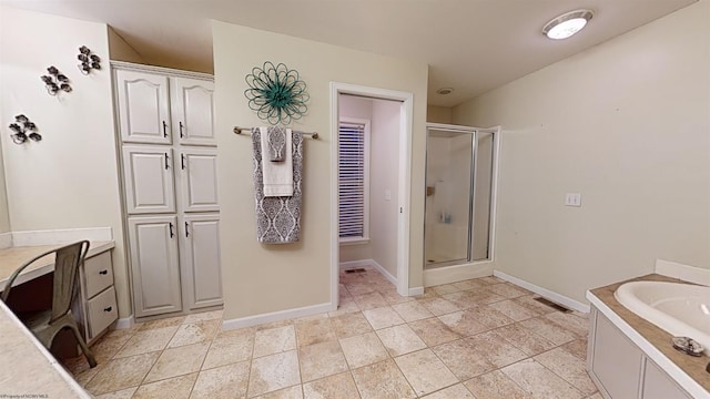 bathroom with shower with separate bathtub and tile patterned floors