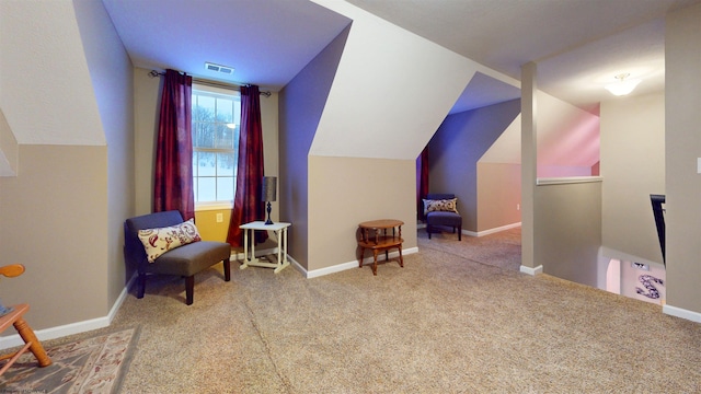 interior space featuring lofted ceiling and carpet floors