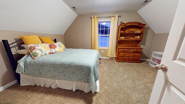 carpeted bedroom with lofted ceiling and a textured ceiling