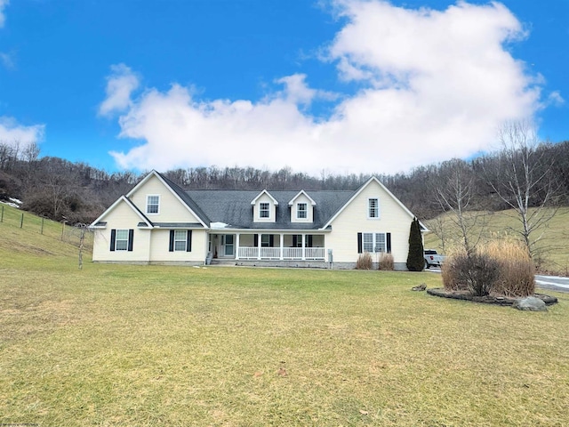 view of front of home with a porch and a front yard