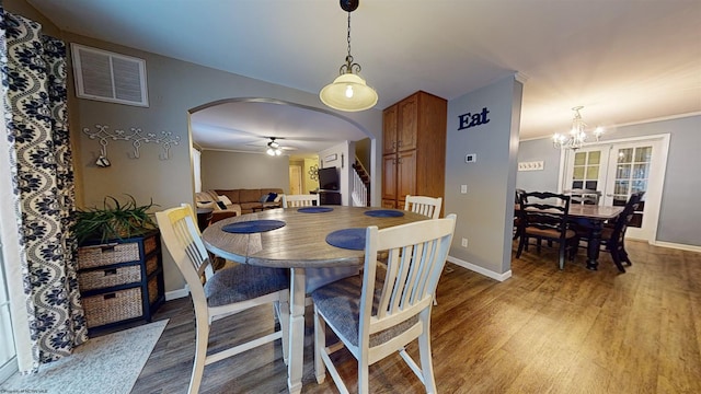 dining area featuring wood-type flooring and ceiling fan