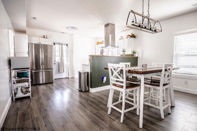 dining room featuring dark hardwood / wood-style flooring