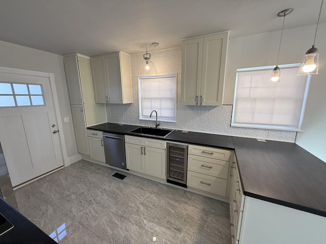 kitchen with pendant lighting, dishwasher, sink, wine cooler, and backsplash