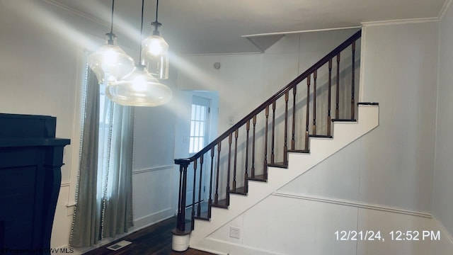 staircase with crown molding