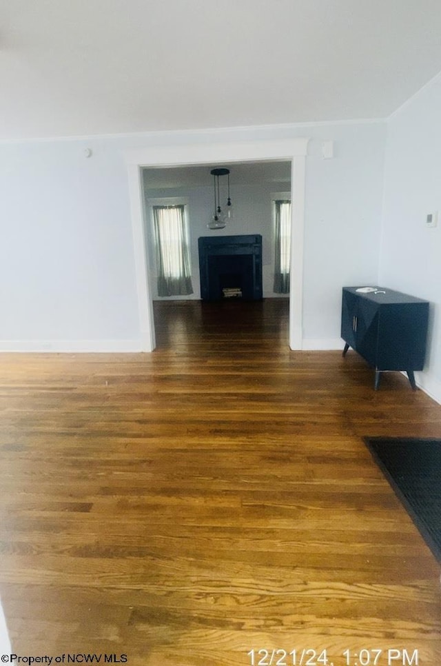 unfurnished living room featuring hardwood / wood-style floors