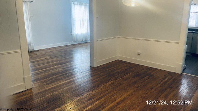 unfurnished room featuring dark hardwood / wood-style floors