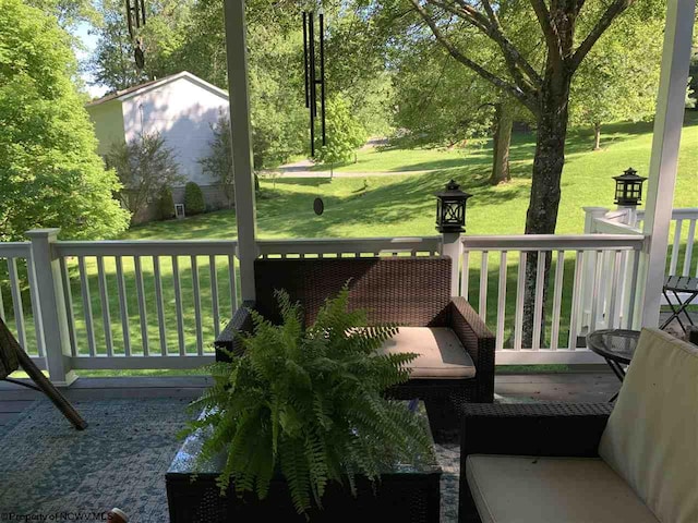 wooden terrace with a yard