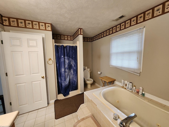 bathroom with tile patterned flooring, independent shower and bath, a textured ceiling, and toilet