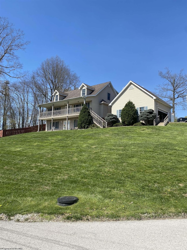 view of side of home with a yard