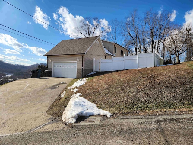 view of home's exterior with a garage