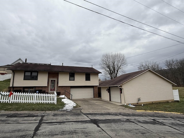 view of front of home featuring a garage and an outdoor structure