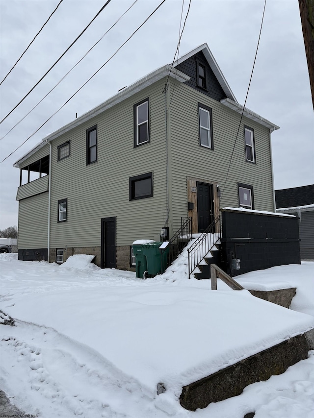 view of snow covered house