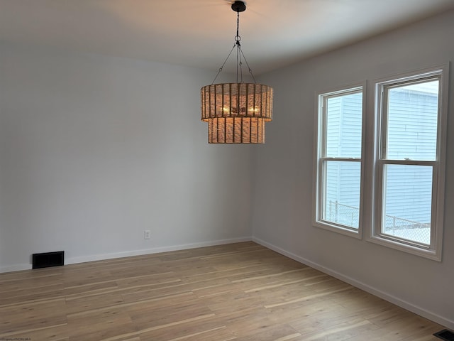 unfurnished room featuring light wood-type flooring