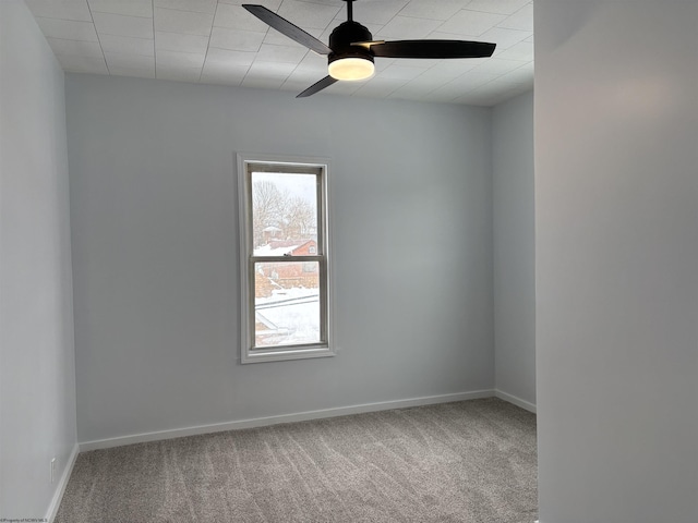 spare room with carpet flooring and ceiling fan