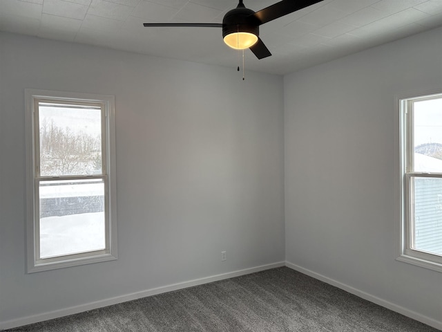 carpeted empty room featuring ceiling fan