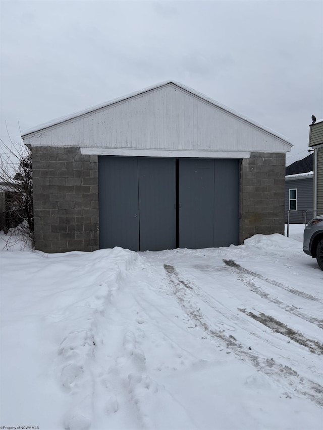 view of snow covered garage