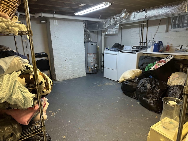 basement with gas water heater and independent washer and dryer