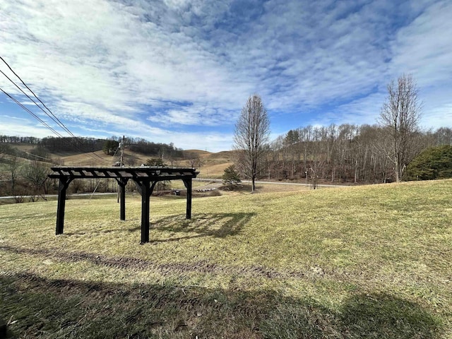 surrounding community featuring a rural view and a yard