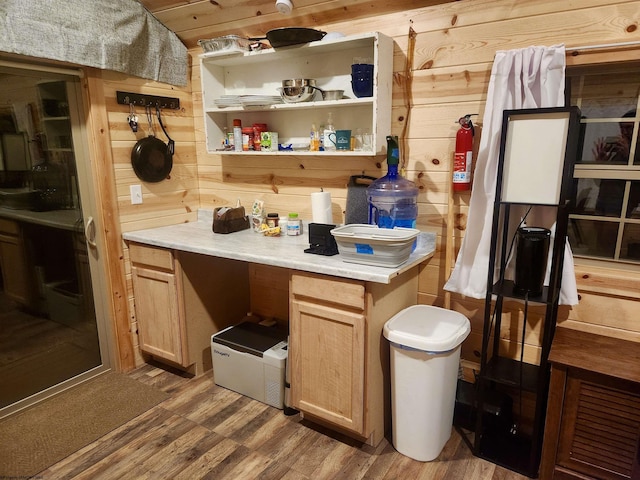 bathroom featuring wood-type flooring and wood walls