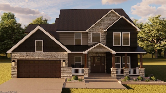 craftsman-style house featuring a garage, a front yard, and covered porch