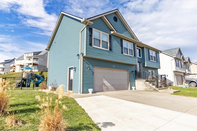 view of front of home with a garage and a playground