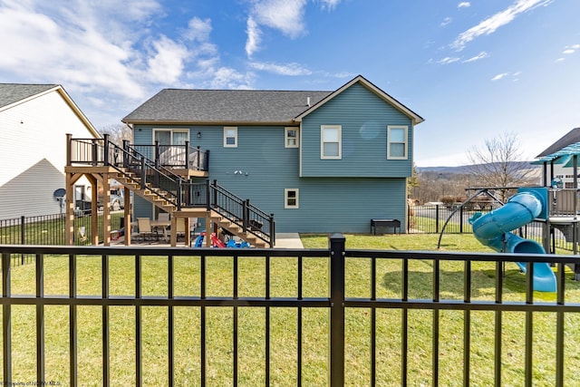 back of property with a playground and a lawn