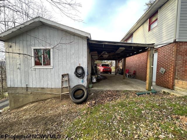 view of home's exterior with a carport