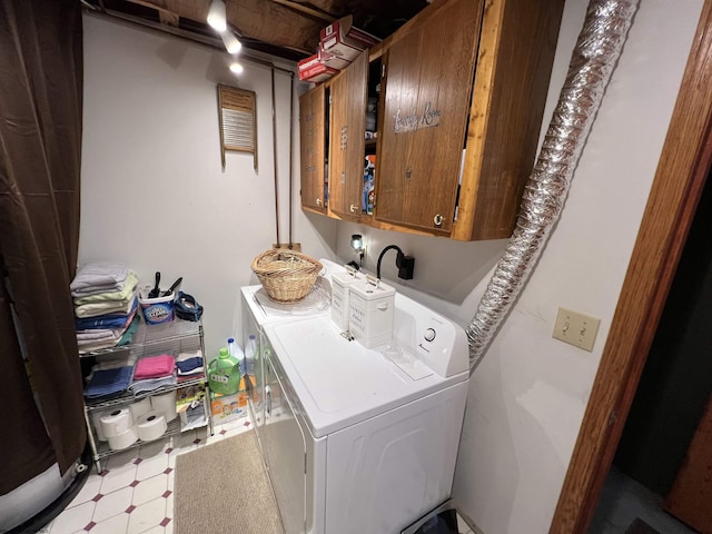 laundry area with independent washer and dryer and cabinets