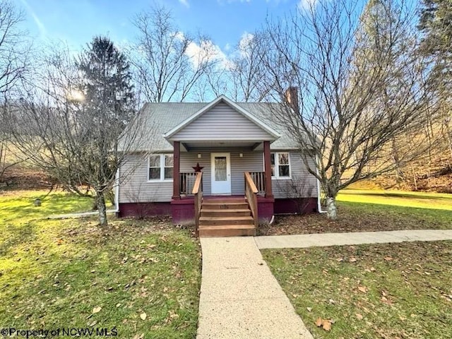 bungalow-style home with a porch and a front yard