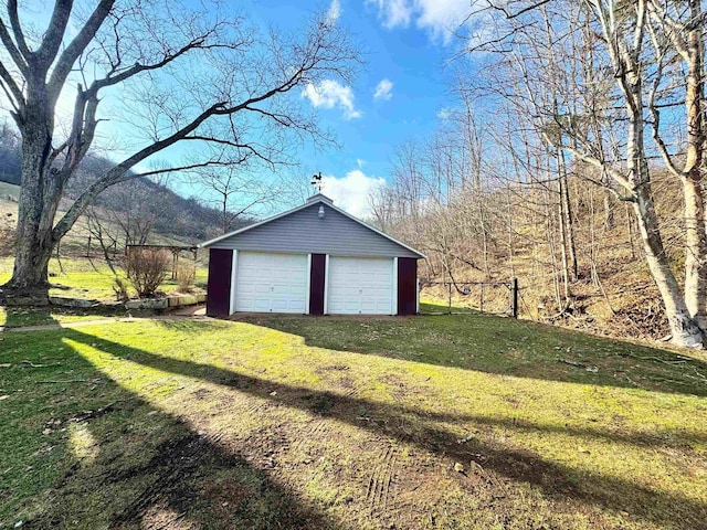 garage with a lawn