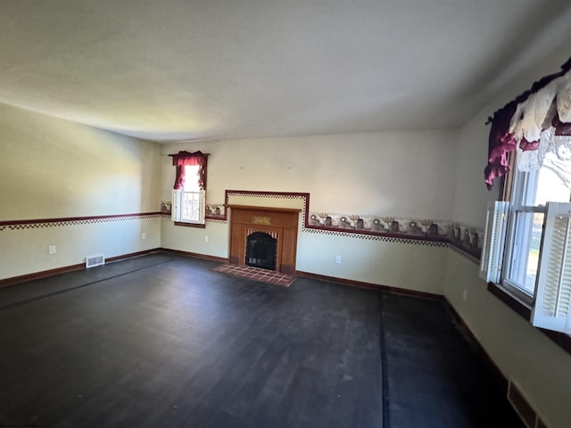 unfurnished living room featuring dark hardwood / wood-style floors