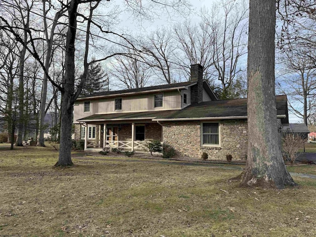 front of property featuring a front yard and a porch