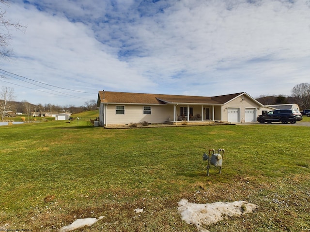 single story home featuring a garage, a front yard, and covered porch