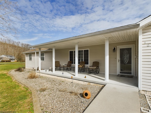 rear view of house with a porch